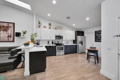 This beautifully and totally updated 2-bed, 2-bath townhouse on Woodmont Country Club in Florida - for sale on GolfHomes.com, golf home, golf lot