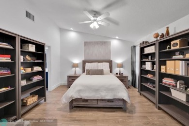 This beautifully and totally updated 2-bed, 2-bath townhouse on Woodmont Country Club in Florida - for sale on GolfHomes.com, golf home, golf lot