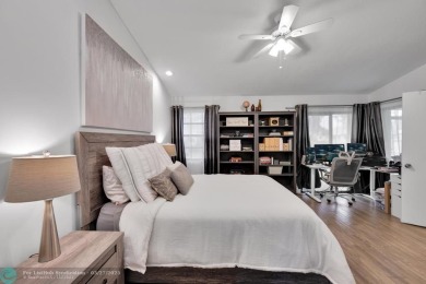 This beautifully and totally updated 2-bed, 2-bath townhouse on Woodmont Country Club in Florida - for sale on GolfHomes.com, golf home, golf lot