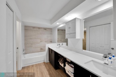 This beautifully and totally updated 2-bed, 2-bath townhouse on Woodmont Country Club in Florida - for sale on GolfHomes.com, golf home, golf lot
