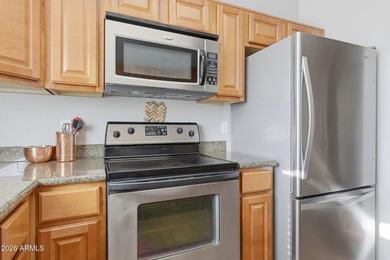 This bright second-floor condo features vaulted ceilings and an on Stonecreek Golf Club in Arizona - for sale on GolfHomes.com, golf home, golf lot