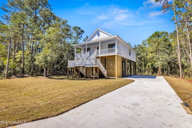 This beautiful new construction is a quick golf cart ride to all on Pass Christian Isles Golf Club in Mississippi - for sale on GolfHomes.com, golf home, golf lot