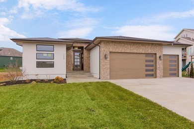 The Woodland by Elevate Design + Build is a reverse 1.5-story 5 on Heritage Park Golf Course in Kansas - for sale on GolfHomes.com, golf home, golf lot