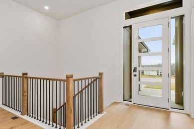 The Woodland by Elevate Design + Build is a reverse 1.5-story 5 on Heritage Park Golf Course in Kansas - for sale on GolfHomes.com, golf home, golf lot