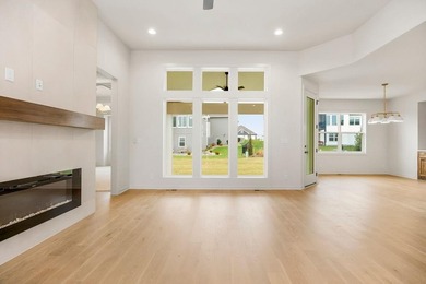 The Woodland by Elevate Design + Build is a reverse 1.5-story 5 on Heritage Park Golf Course in Kansas - for sale on GolfHomes.com, golf home, golf lot