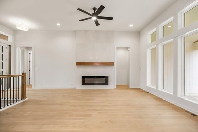 The Woodland by Elevate Design + Build is a reverse 1.5-story 5 on Heritage Park Golf Course in Kansas - for sale on GolfHomes.com, golf home, golf lot