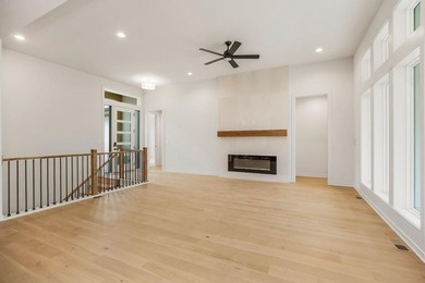 The Woodland by Elevate Design + Build is a reverse 1.5-story 5 on Heritage Park Golf Course in Kansas - for sale on GolfHomes.com, golf home, golf lot