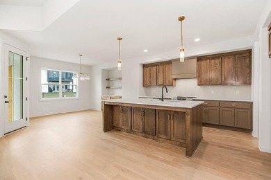 The Woodland by Elevate Design + Build is a reverse 1.5-story 5 on Heritage Park Golf Course in Kansas - for sale on GolfHomes.com, golf home, golf lot