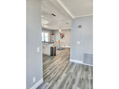 If you've been searching for a beautifully updated home in sunny on Lake Fairways Country Club in Florida - for sale on GolfHomes.com, golf home, golf lot
