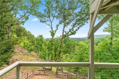 This stunning home offers privacy and views of Lake Arrowhead on The Highlands Course at Lake Arrowhead in Georgia - for sale on GolfHomes.com, golf home, golf lot