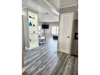 If you've been searching for a beautifully updated home in sunny on Lake Fairways Country Club in Florida - for sale on GolfHomes.com, golf home, golf lot