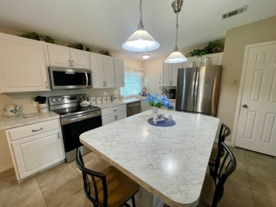 Check this out!! This home has been meticulously kept with on Water Oak Country Club Estates in Florida - for sale on GolfHomes.com, golf home, golf lot