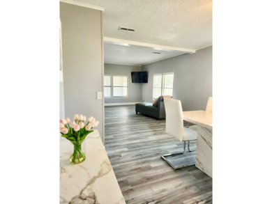 If you've been searching for a beautifully updated home in sunny on Lake Fairways Country Club in Florida - for sale on GolfHomes.com, golf home, golf lot