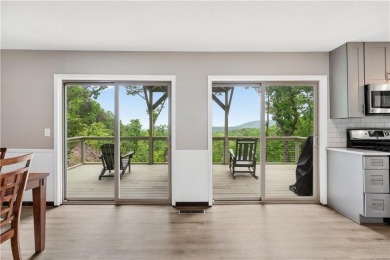 This stunning home offers privacy and views of Lake Arrowhead on The Highlands Course at Lake Arrowhead in Georgia - for sale on GolfHomes.com, golf home, golf lot