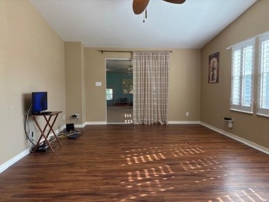 Come and take a look at this large triple-wide manufactured home on Country Club of Mount Dora in Florida - for sale on GolfHomes.com, golf home, golf lot