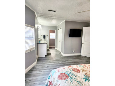 If you've been searching for a beautifully updated home in sunny on Lake Fairways Country Club in Florida - for sale on GolfHomes.com, golf home, golf lot