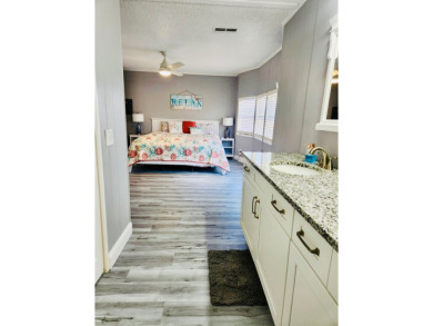 If you've been searching for a beautifully updated home in sunny on Lake Fairways Country Club in Florida - for sale on GolfHomes.com, golf home, golf lot