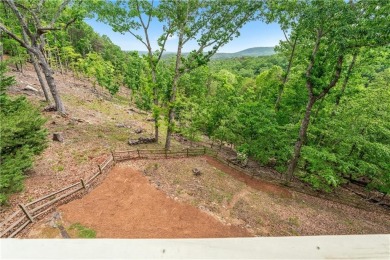 This stunning home offers privacy and views of Lake Arrowhead on The Highlands Course at Lake Arrowhead in Georgia - for sale on GolfHomes.com, golf home, golf lot