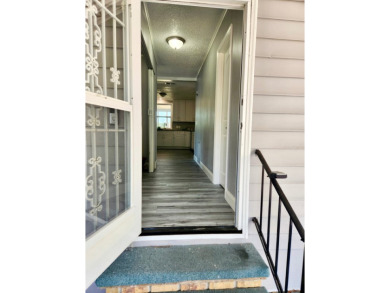 If you've been searching for a beautifully updated home in sunny on Lake Fairways Country Club in Florida - for sale on GolfHomes.com, golf home, golf lot
