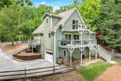 This stunning home offers privacy and views of Lake Arrowhead on The Highlands Course at Lake Arrowhead in Georgia - for sale on GolfHomes.com, golf home, golf lot