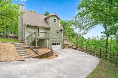 This stunning home offers privacy and views of Lake Arrowhead on The Highlands Course at Lake Arrowhead in Georgia - for sale on GolfHomes.com, golf home, golf lot