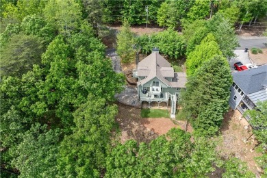 This stunning home offers privacy and views of Lake Arrowhead on The Highlands Course at Lake Arrowhead in Georgia - for sale on GolfHomes.com, golf home, golf lot
