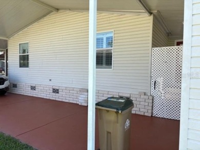 Come and take a look at this large triple-wide manufactured home on Country Club of Mount Dora in Florida - for sale on GolfHomes.com, golf home, golf lot