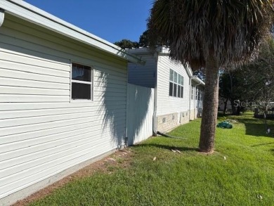 Come and take a look at this large triple-wide manufactured home on Country Club of Mount Dora in Florida - for sale on GolfHomes.com, golf home, golf lot