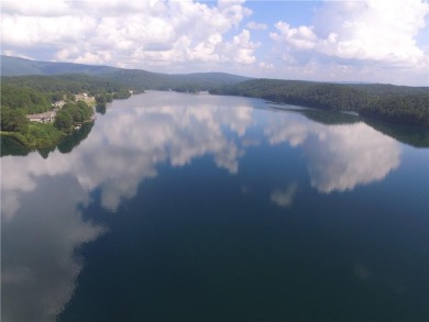 This stunning home offers privacy and views of Lake Arrowhead on The Highlands Course at Lake Arrowhead in Georgia - for sale on GolfHomes.com, golf home, golf lot