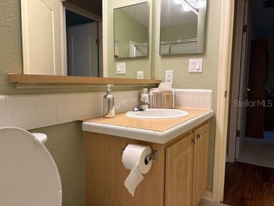 Come and take a look at this large triple-wide manufactured home on Country Club of Mount Dora in Florida - for sale on GolfHomes.com, golf home, golf lot