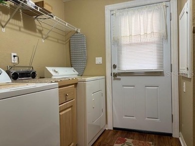 Come and take a look at this large triple-wide manufactured home on Country Club of Mount Dora in Florida - for sale on GolfHomes.com, golf home, golf lot