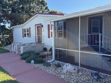 Come and take a look at this large triple-wide manufactured home on Country Club of Mount Dora in Florida - for sale on GolfHomes.com, golf home, golf lot