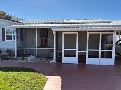 Come and take a look at this large triple-wide manufactured home on Country Club of Mount Dora in Florida - for sale on GolfHomes.com, golf home, golf lot