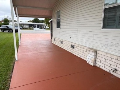 Come and take a look at this large triple-wide manufactured home on Country Club of Mount Dora in Florida - for sale on GolfHomes.com, golf home, golf lot