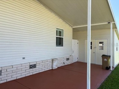 Come and take a look at this large triple-wide manufactured home on Country Club of Mount Dora in Florida - for sale on GolfHomes.com, golf home, golf lot