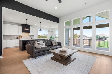 This new reverse 1.5-story Somerset plan by Elevate Design + on Heritage Park Golf Course in Kansas - for sale on GolfHomes.com, golf home, golf lot