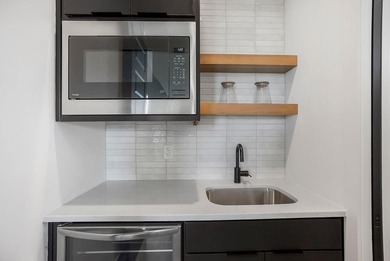 This new reverse 1.5-story Somerset plan by Elevate Design + on Heritage Park Golf Course in Kansas - for sale on GolfHomes.com, golf home, golf lot