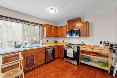 A storybook mountain bungalow offering the gentle ambiance of on Bent Tree Golf Course in Georgia - for sale on GolfHomes.com, golf home, golf lot