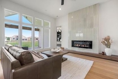 This new reverse 1.5-story Somerset plan by Elevate Design + on Heritage Park Golf Course in Kansas - for sale on GolfHomes.com, golf home, golf lot