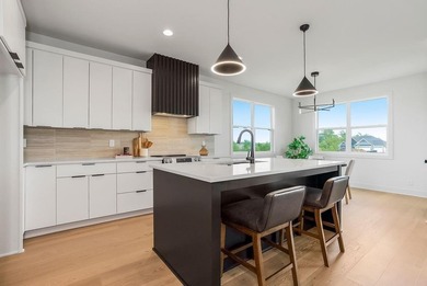 This new reverse 1.5-story Somerset plan by Elevate Design + on Heritage Park Golf Course in Kansas - for sale on GolfHomes.com, golf home, golf lot