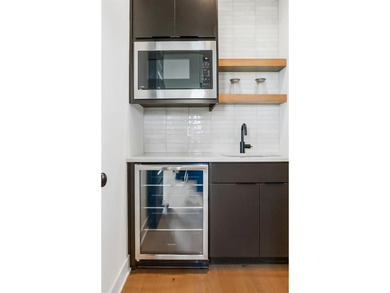 This new reverse 1.5-story Somerset plan by Elevate Design + on Heritage Park Golf Course in Kansas - for sale on GolfHomes.com, golf home, golf lot