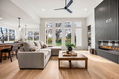 This new reverse 1.5-story Somerset plan by Elevate Design + on Heritage Park Golf Course in Kansas - for sale on GolfHomes.com, golf home, golf lot