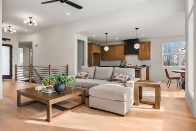 This new reverse 1.5-story Somerset plan by Elevate Design + on Heritage Park Golf Course in Kansas - for sale on GolfHomes.com, golf home, golf lot