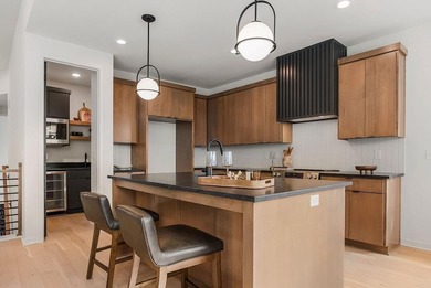 This new reverse 1.5-story Somerset plan by Elevate Design + on Heritage Park Golf Course in Kansas - for sale on GolfHomes.com, golf home, golf lot