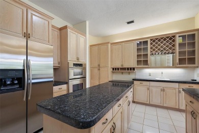 WECOME HOME!  The scenic views of this executive pool home will on Harbor Hills Country Club in Florida - for sale on GolfHomes.com, golf home, golf lot