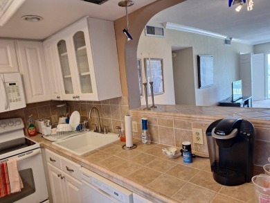 HUGE PRICE REDUCTION..E LIVE THE LIFESTYLE! Breathtaking on Palm-Aire Country Club and Resort - Palms in Florida - for sale on GolfHomes.com, golf home, golf lot