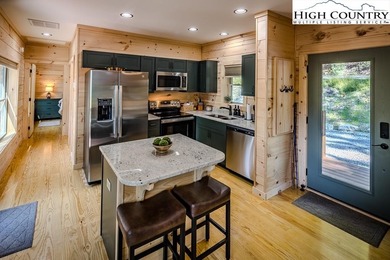 GREAT PRICE - RENTAL READY! Outstanding Log Cabin in Prime Beech on Beech Mountain Club in North Carolina - for sale on GolfHomes.com, golf home, golf lot