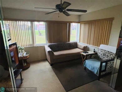 This charming two-bedroom, two-bath condo offers a cozy retreat on Sunrise Lakes Phase III in Florida - for sale on GolfHomes.com, golf home, golf lot