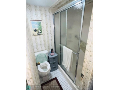 This charming two-bedroom, two-bath condo offers a cozy retreat on Sunrise Lakes Phase III in Florida - for sale on GolfHomes.com, golf home, golf lot
