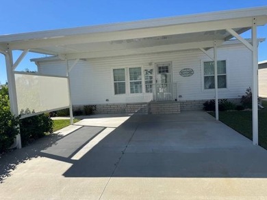 Welcome home to this impeccable 2-bedroom 2-bath sanctuary on Cypresswood Golf and Country Club in Florida - for sale on GolfHomes.com, golf home, golf lot